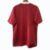 Red football jersey with white collar, back view for sportswear.