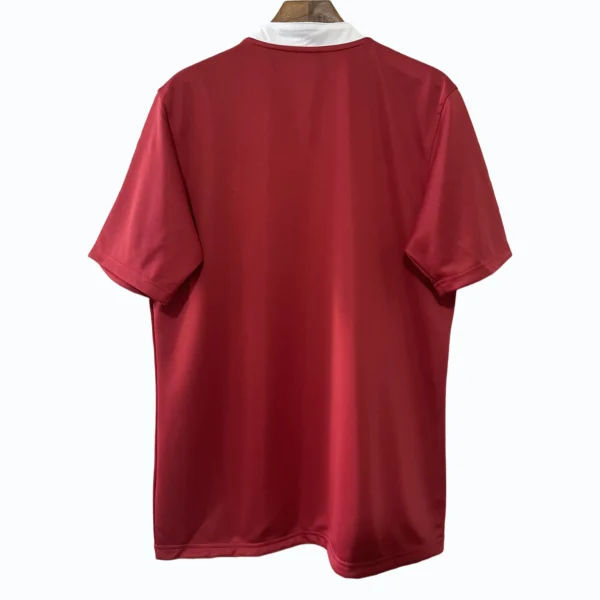 Red football jersey with white collar, back view for sportswear.