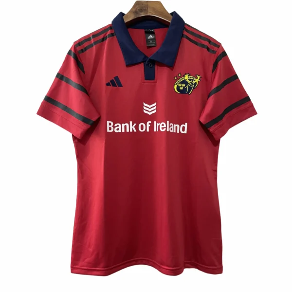 Sports jersey featuring team crest, sponsor logo, and stylish design elements.