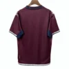 Football jersey with maroon and navy accents for sports teams and fans. Maroon and navy sports jersey for football fans and team players.