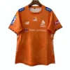 Football jersey with sponsor logos and vibrant orange color for sports fans and athletes. Orange sports jersey with sponsor logos, ideal for football players and sports enthusiasts.
