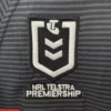 Sports jersey with NRL Telstra Premiership logo and team stripes. NRL Telstra Premiership logo on sports jersey for rugby fans.