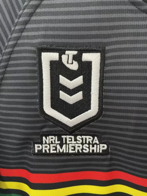 Sports jersey with NRL Telstra Premiership logo and team stripes. NRL Telstra Premiership logo on sports jersey for rugby fans.