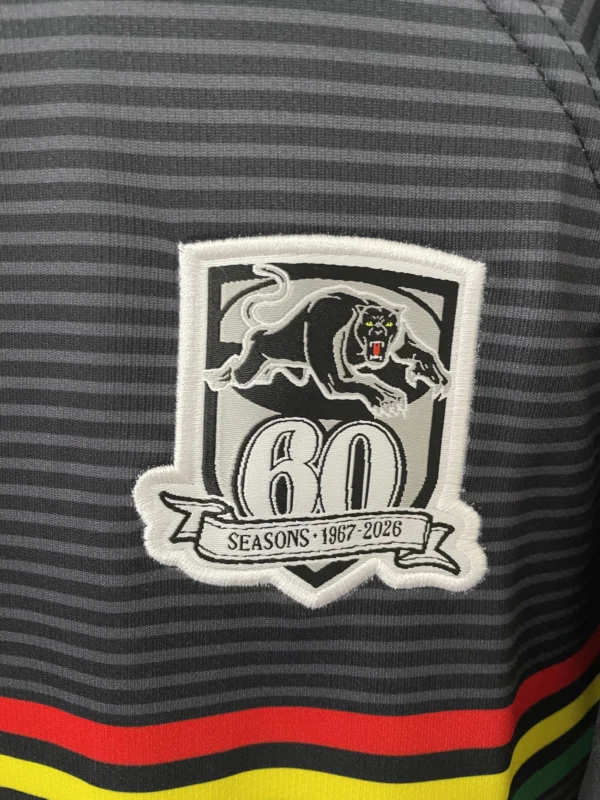 Celebrating 60 Years of Excellence Embroidered patch featuring a fierce black panther and the number 60, symbolizing six decades of spo.