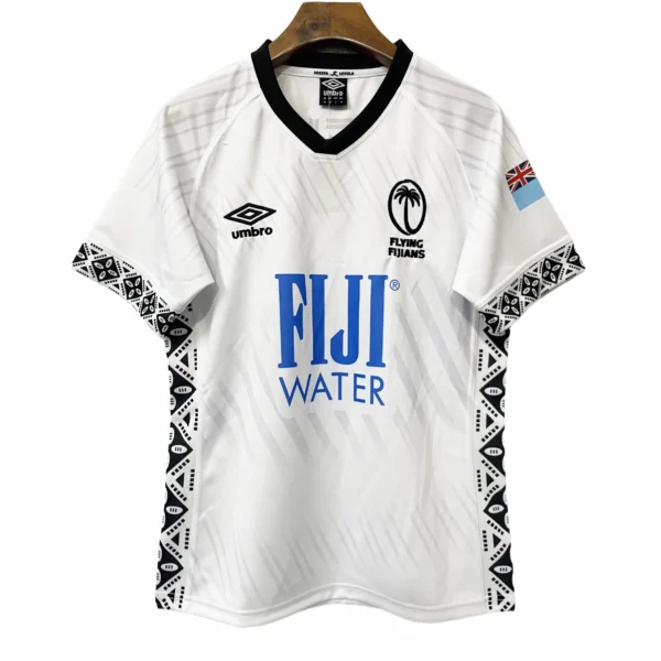 Football jersey with Fiji Water sponsorship, UK flag patch, and Polynesian-inspired black and white.