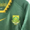 South Africa Rugby Jersey Close-up of South Africa rugby jersey with team emblem and vibrant green color.