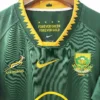 South Africa Rugby Jersey with Green and Gold Design South Africa rugby jersey featuring green and gold colors with team logos and sponsor details.