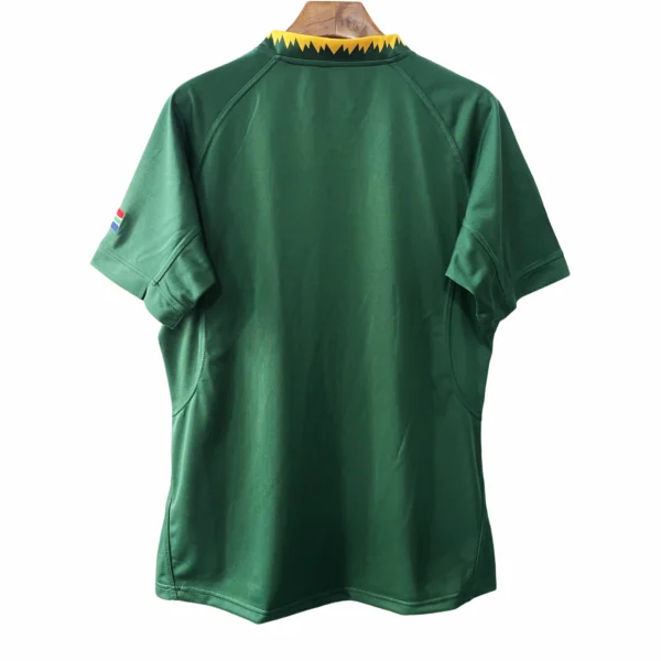 Football jersey with green color and yellow collar detail Green football jersey with yellow collar detail, designed for sports performance and team support.