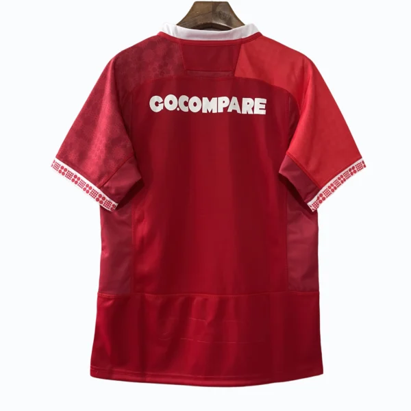 Football jersey with "COCOMPARE" logo on the back, red color, and white accents. Red football jersey with "COCOMPARE" logo on the back, designed for sports and team uniforms.