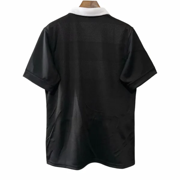 Sports Jersey with Black and White Design Sports jersey featuring black fabric with white collar detail for athletic wear.