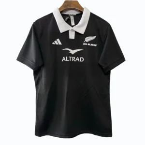 Rugby Jersey with All Blacks Logo Black rugby jersey featuring All Blacks logo and sponsor branding, ideal for sports enthusiasts.