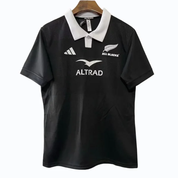 Rugby Jersey with All Blacks Logo Black rugby jersey featuring All Blacks logo and sponsor branding, ideal for sports enthusiasts.