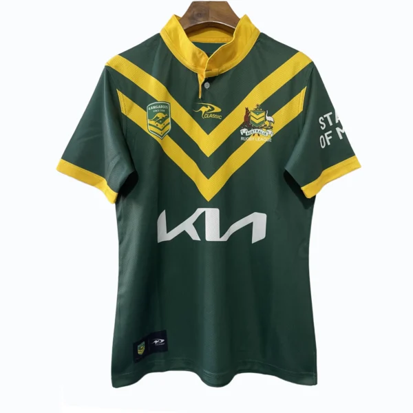 Sports team jersey featuring green and yellow colors with team logos and sponsor branding.