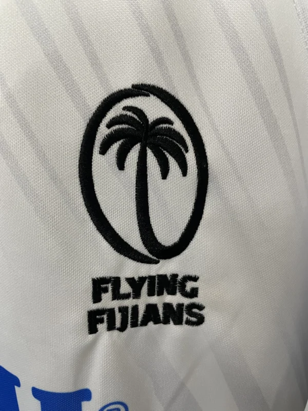 Palm tree logo embroidered on sportswear fabric.